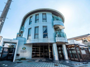 Гостиница Asuka Hotel  Карацу